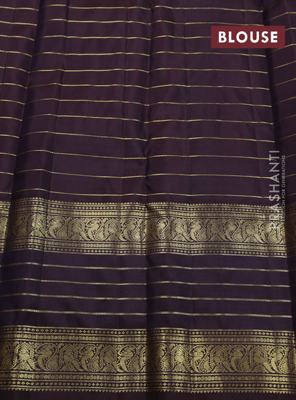 Pure kanchipuram silk saree peacock blue and deep wine with allover zari stripes pattern and long zari woven border