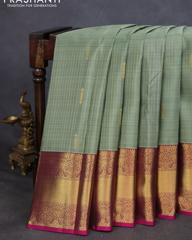 Pure kanchipuram silk saree pastel green and magenta pink with allover zari weaves and zari woven border