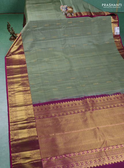 Pure kanchipuram silk saree pastel green and magenta pink with allover zari weaves and zari woven border