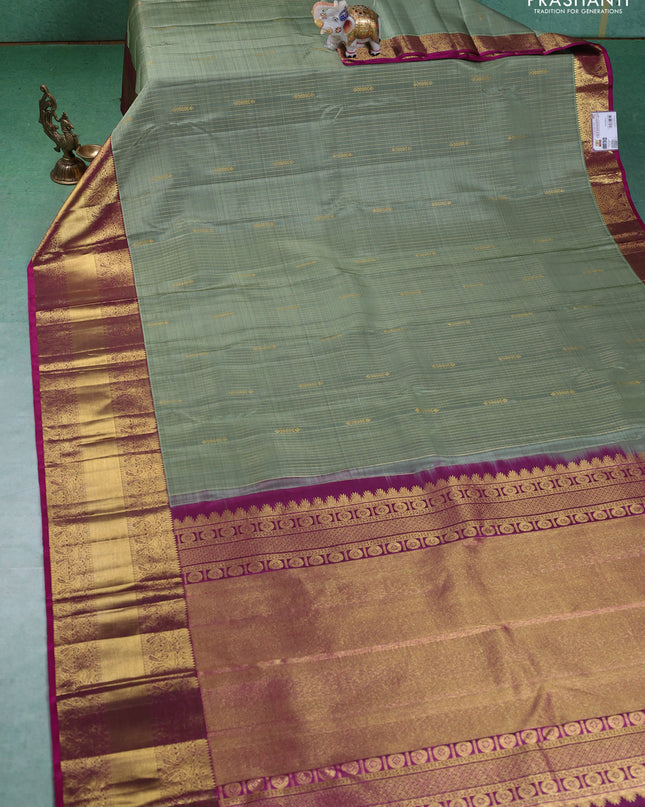 Pure kanchipuram silk saree pastel green and magenta pink with allover zari weaves and zari woven border