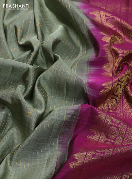 Pure kanchipuram silk saree pastel green and magenta pink with allover zari weaves and zari woven border