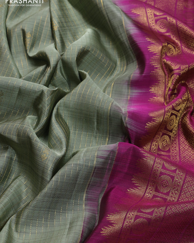 Pure kanchipuram silk saree pastel green and magenta pink with allover zari weaves and zari woven border