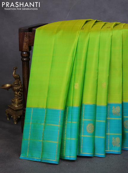 Pure kanchipuram silk saree lime green and teal blue with annam zari woven buttas and zari checked butta border