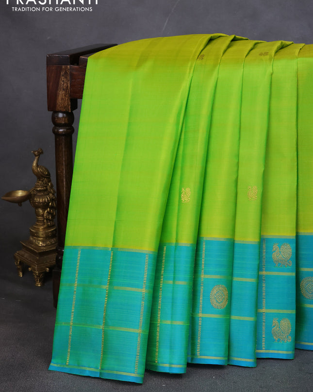 Pure kanchipuram silk saree lime green and teal blue with annam zari woven buttas and zari checked butta border
