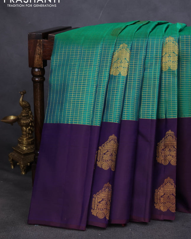 Pure kanchipuram silk saree teal green and navy blue with allover small zari checked pattern and zari woven butta border