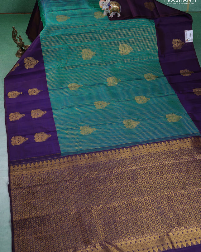 Pure kanchipuram silk saree teal green and navy blue with allover small zari checked pattern and zari woven butta border