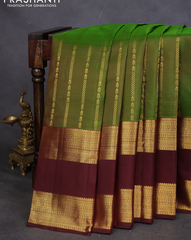 Pure kanchipuram silk saree green and deep maroon with allover zari weaves and rettapet zari woven border