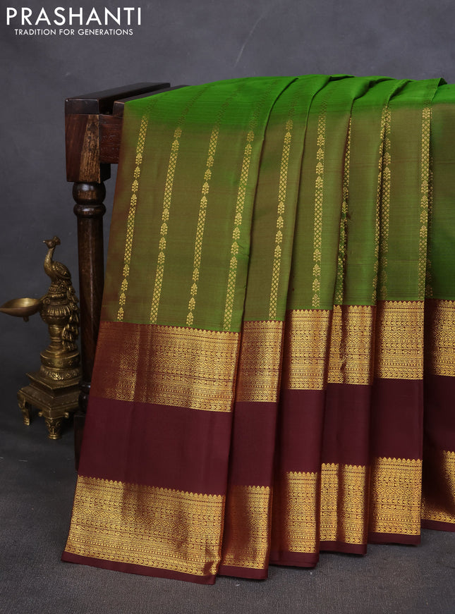 Pure kanchipuram silk saree green and deep maroon with allover zari weaves and rettapet zari woven border