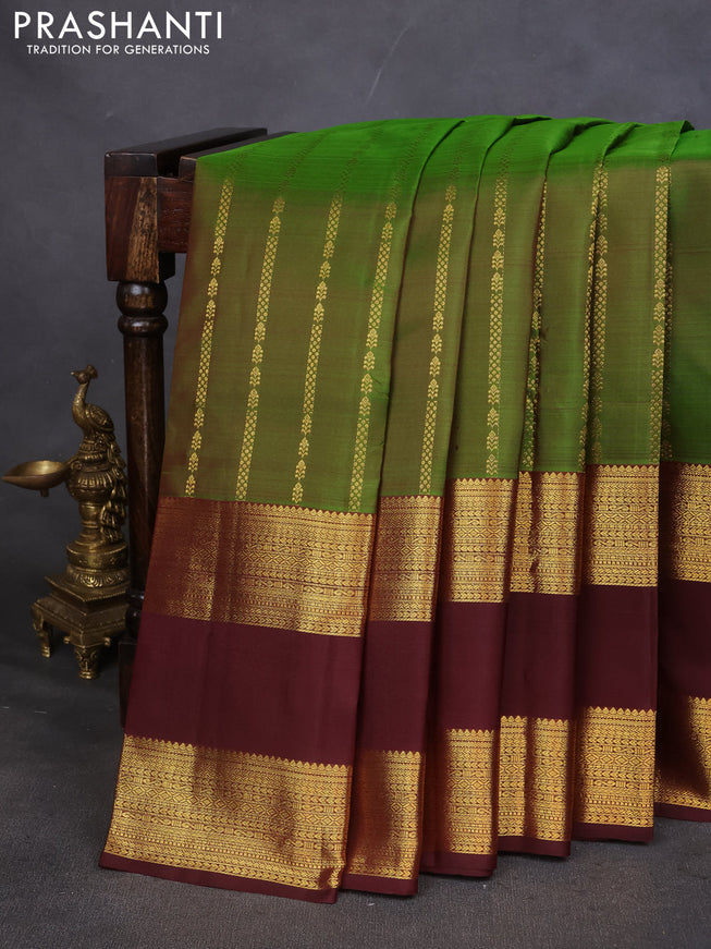Pure kanchipuram silk saree green and deep maroon with allover zari weaves and rettapet zari woven border
