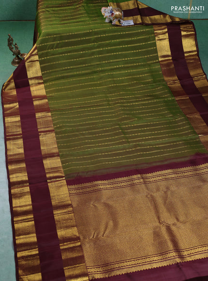 Pure kanchipuram silk saree green and deep maroon with allover zari weaves and rettapet zari woven border
