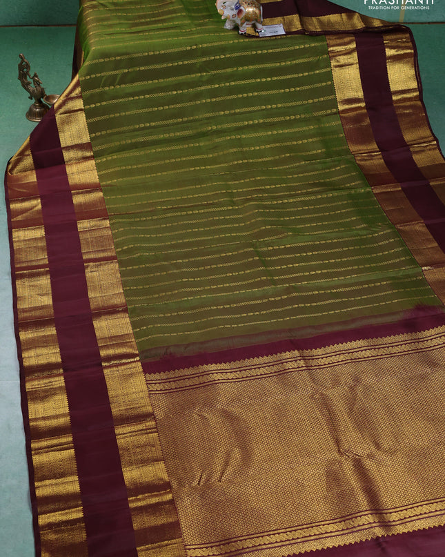Pure kanchipuram silk saree green and deep maroon with allover zari weaves and rettapet zari woven border