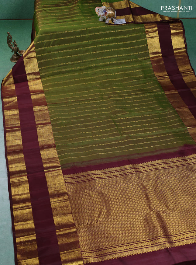 Pure kanchipuram silk saree green and deep maroon with allover zari weaves and rettapet zari woven border