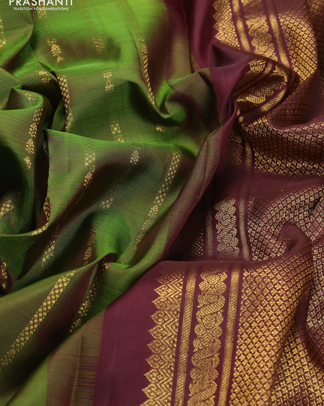Pure kanchipuram silk saree green and deep maroon with allover zari weaves and rettapet zari woven border