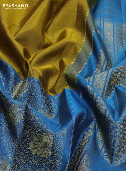 Pure kanchipuram silk saree mehendi green and cs blue with half & half style and long zari woven border