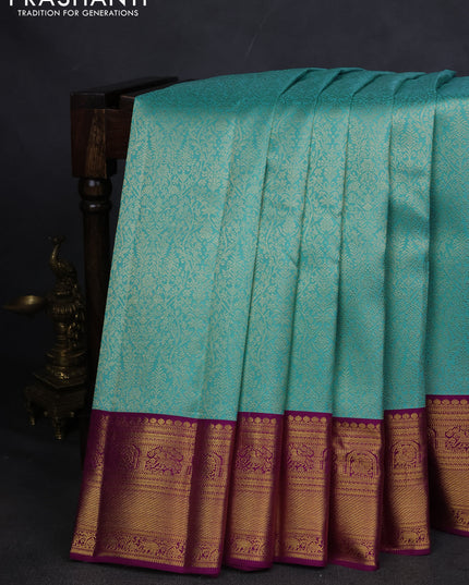 Pure kanchipuram silk saree teal blue and purple with allover zari woven brocade weaves and zari woven korvai border