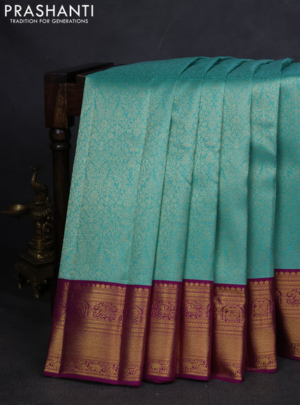 Pure kanchipuram silk saree teal blue and purple with allover zari woven brocade weaves and zari woven korvai border