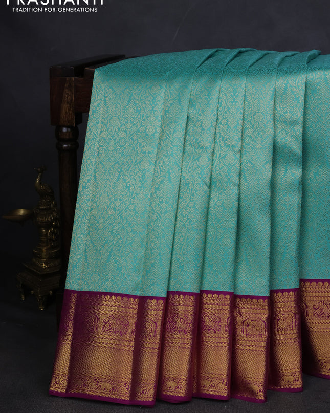 Pure kanchipuram silk saree teal blue and purple with allover zari woven brocade weaves and zari woven korvai border