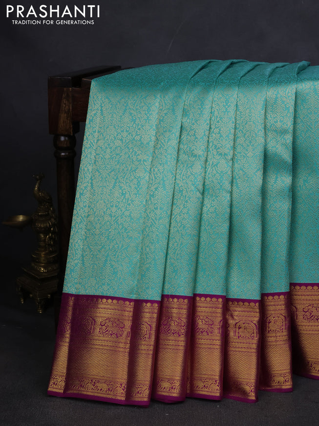 Pure kanchipuram silk saree teal blue and purple with allover zari woven brocade weaves and zari woven korvai border