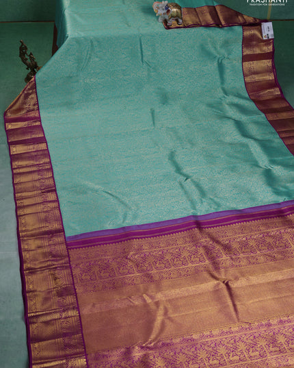 Pure kanchipuram silk saree teal blue and purple with allover zari woven brocade weaves and zari woven korvai border