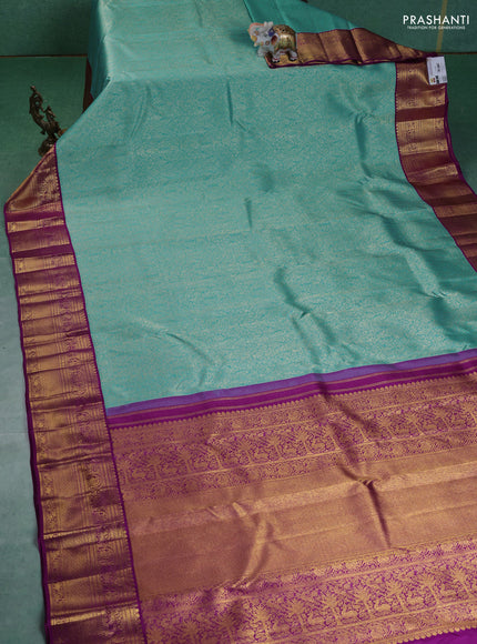 Pure kanchipuram silk saree teal blue and purple with allover zari woven brocade weaves and zari woven korvai border