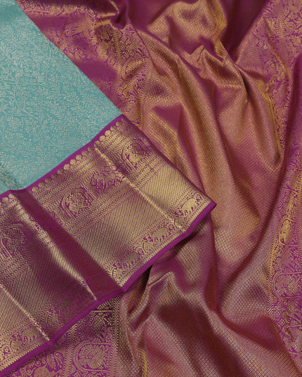 Pure kanchipuram silk saree teal blue and purple with allover zari woven brocade weaves and zari woven korvai border
