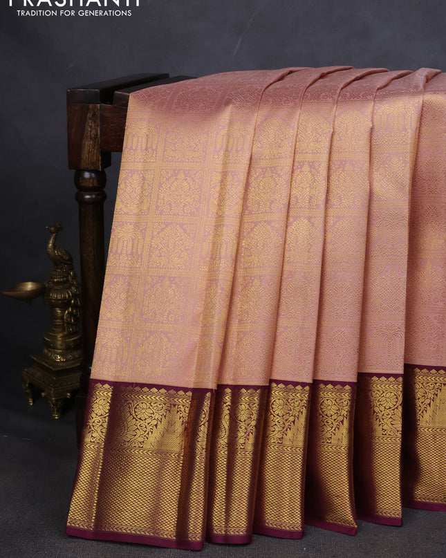Pure kanchipuram silk saree peach shade and wine shade with allover zari woven brocade weaves and zari woven korvai border