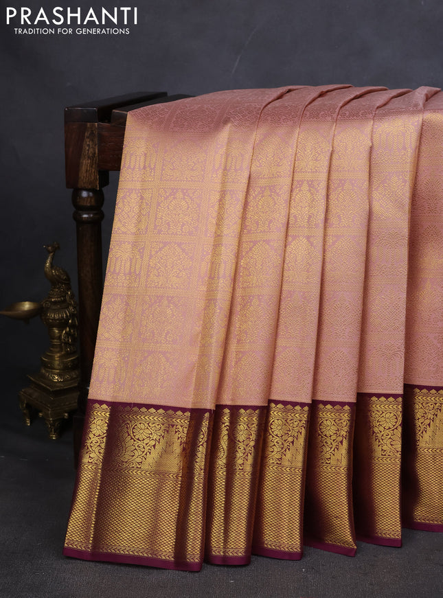 Pure kanchipuram silk saree peach shade and wine shade with allover zari woven brocade weaves and zari woven korvai border