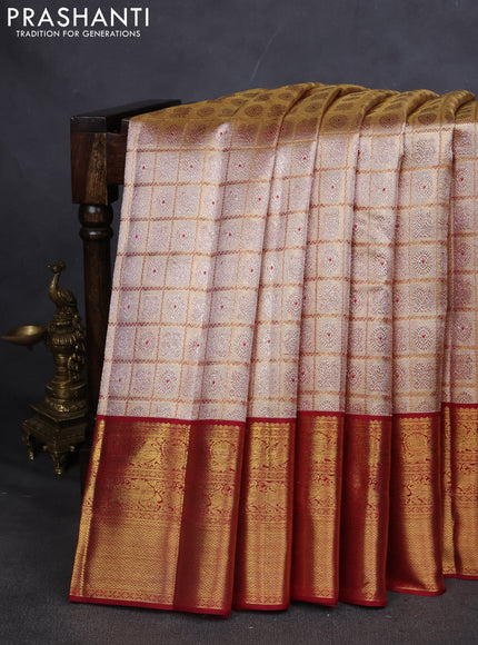 Pure kanchipuram silk saree gold and maroon with allover zari woven brocade weaves and zari woven korvai border