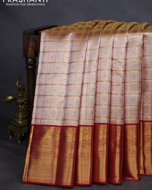 Pure kanchipuram silk saree gold and maroon with allover zari woven brocade weaves and zari woven korvai border