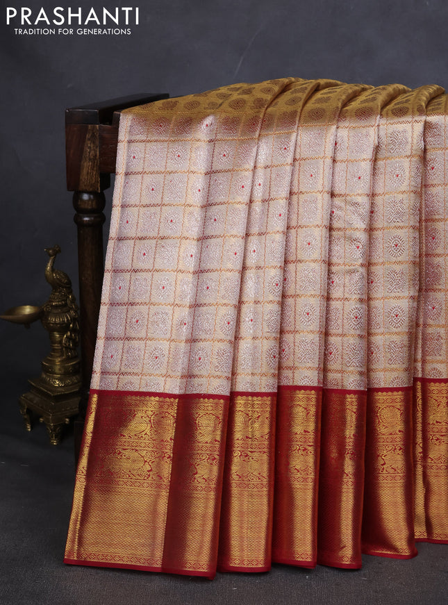 Pure kanchipuram silk saree gold and maroon with allover zari woven brocade weaves and zari woven korvai border