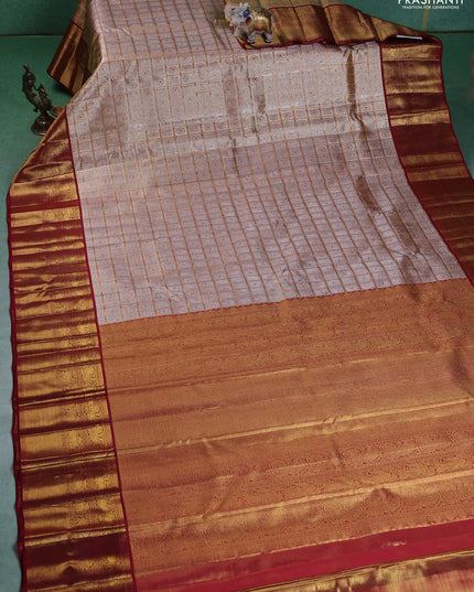 Pure kanchipuram silk saree gold and maroon with allover zari woven brocade weaves and zari woven korvai border