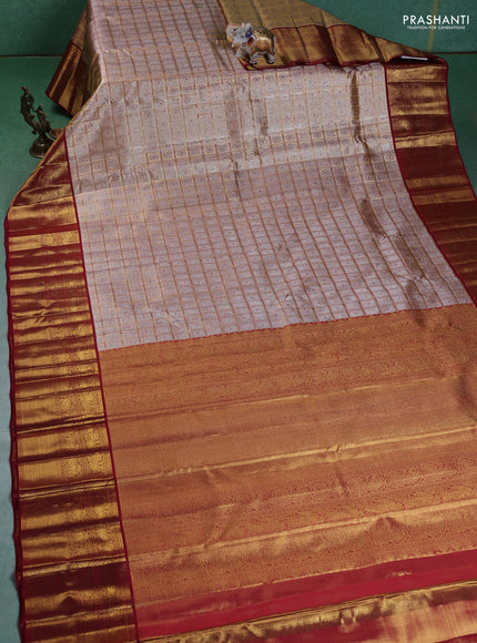 Pure kanchipuram silk saree gold and maroon with allover zari woven brocade weaves and zari woven korvai border