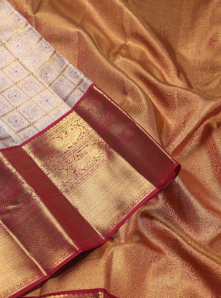 Pure kanchipuram silk saree gold and maroon with allover zari woven brocade weaves and zari woven korvai border