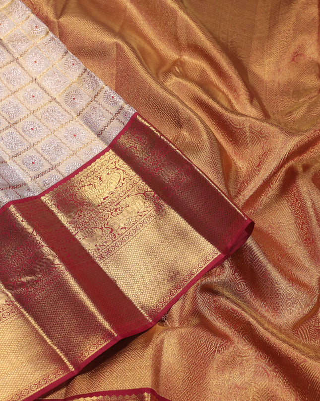 Pure kanchipuram silk saree gold and maroon with allover zari woven brocade weaves and zari woven korvai border