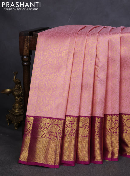 Pure kanchipuram silk saree light pink and purple with allover zari woven brocade weaves and zari woven korvai border