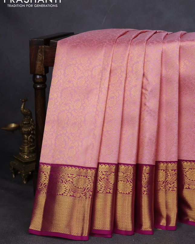Pure kanchipuram silk saree light pink and purple with allover zari woven brocade weaves and zari woven korvai border