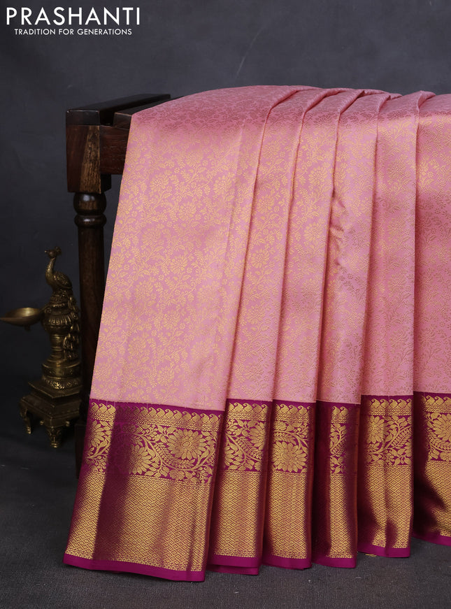 Pure kanchipuram silk saree light pink and purple with allover zari woven brocade weaves and zari woven korvai border