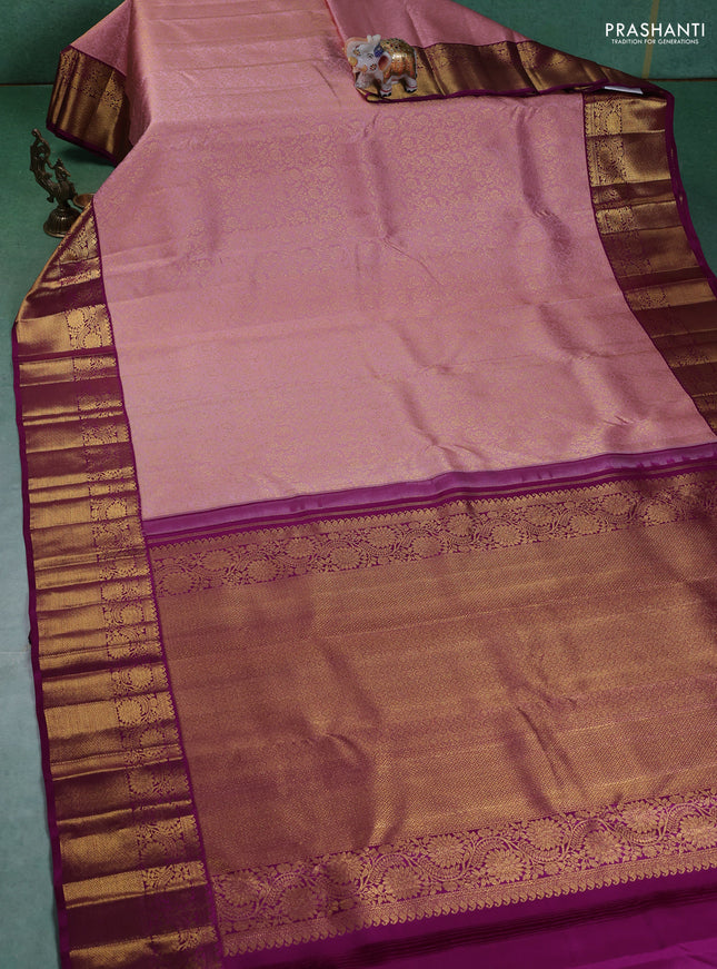 Pure kanchipuram silk saree light pink and purple with allover zari woven brocade weaves and zari woven korvai border