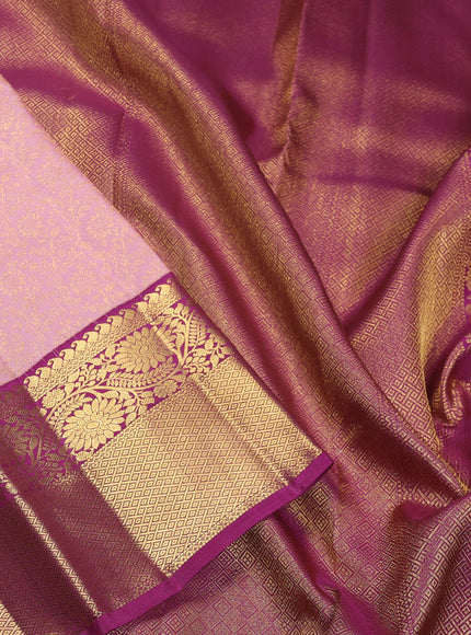 Pure kanchipuram silk saree light pink and purple with allover zari woven brocade weaves and zari woven korvai border