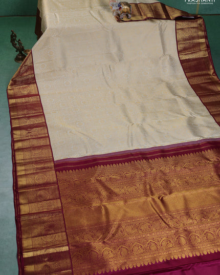 Pure kanchipuram silk saree cream and maroon with allover zari woven brocade weaves and zari woven korvai border