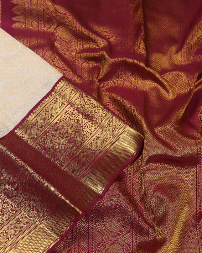 Pure kanchipuram silk saree cream and maroon with allover zari woven brocade weaves and zari woven korvai border