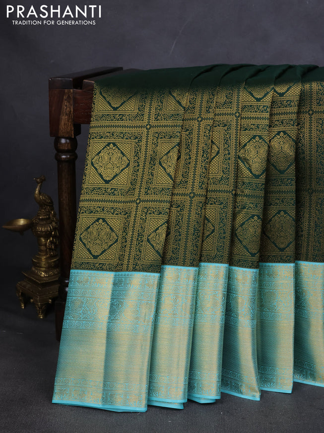 Pure kanchipuram silk saree green and teal blue with allover zari woven brocade weaves and zari woven korvai border