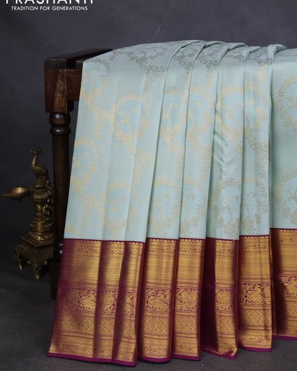 Pure kanchipuram silk saree pastel blue and purple with allover zari woven brocade weaves and zari woven korvai border