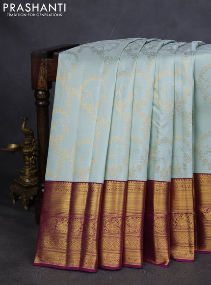 Pure kanchipuram silk saree pastel blue and purple with allover zari woven brocade weaves and zari woven korvai border