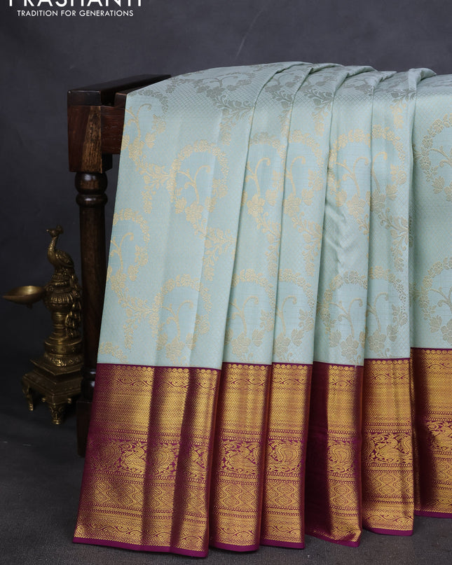 Pure kanchipuram silk saree pastel blue and purple with allover zari woven brocade weaves and zari woven korvai border