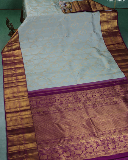 Pure kanchipuram silk saree pastel blue and purple with allover zari woven brocade weaves and zari woven korvai border