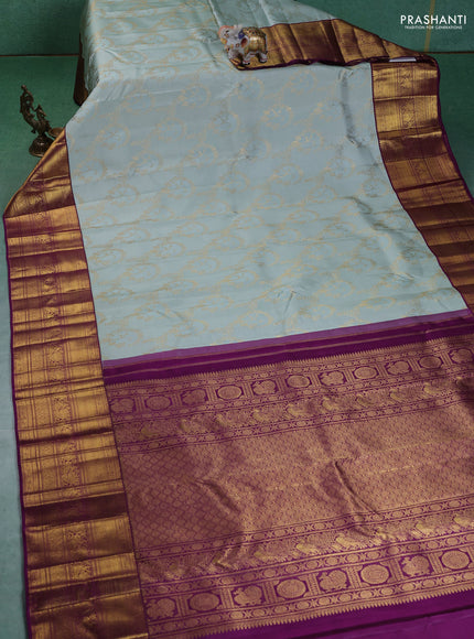 Pure kanchipuram silk saree pastel blue and purple with allover zari woven brocade weaves and zari woven korvai border