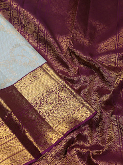 Pure kanchipuram silk saree pastel blue and purple with allover zari woven brocade weaves and zari woven korvai border