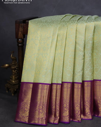 Pure kanchipuram silk saree pista green and violet with allover zari woven brocade weaves and zari woven korvai border