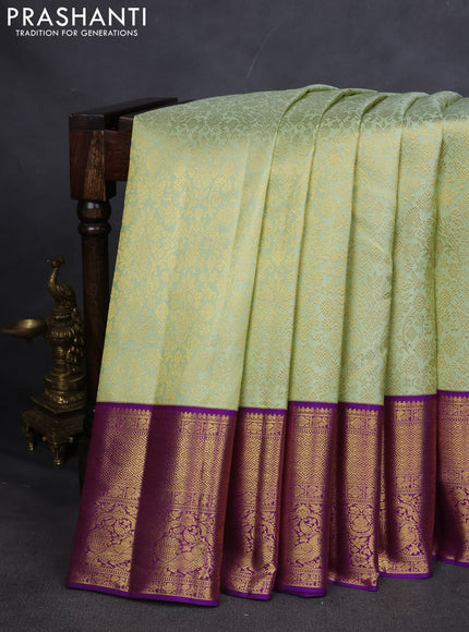 Pure kanchipuram silk saree pista green and violet with allover zari woven brocade weaves and zari woven korvai border